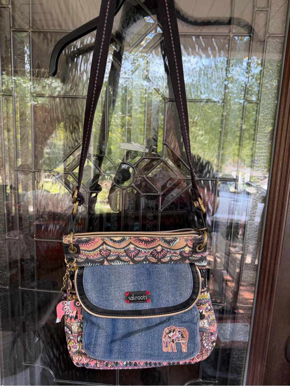 Sakroots Denim Blue Crossbody with Pink and Multicolor Pattern